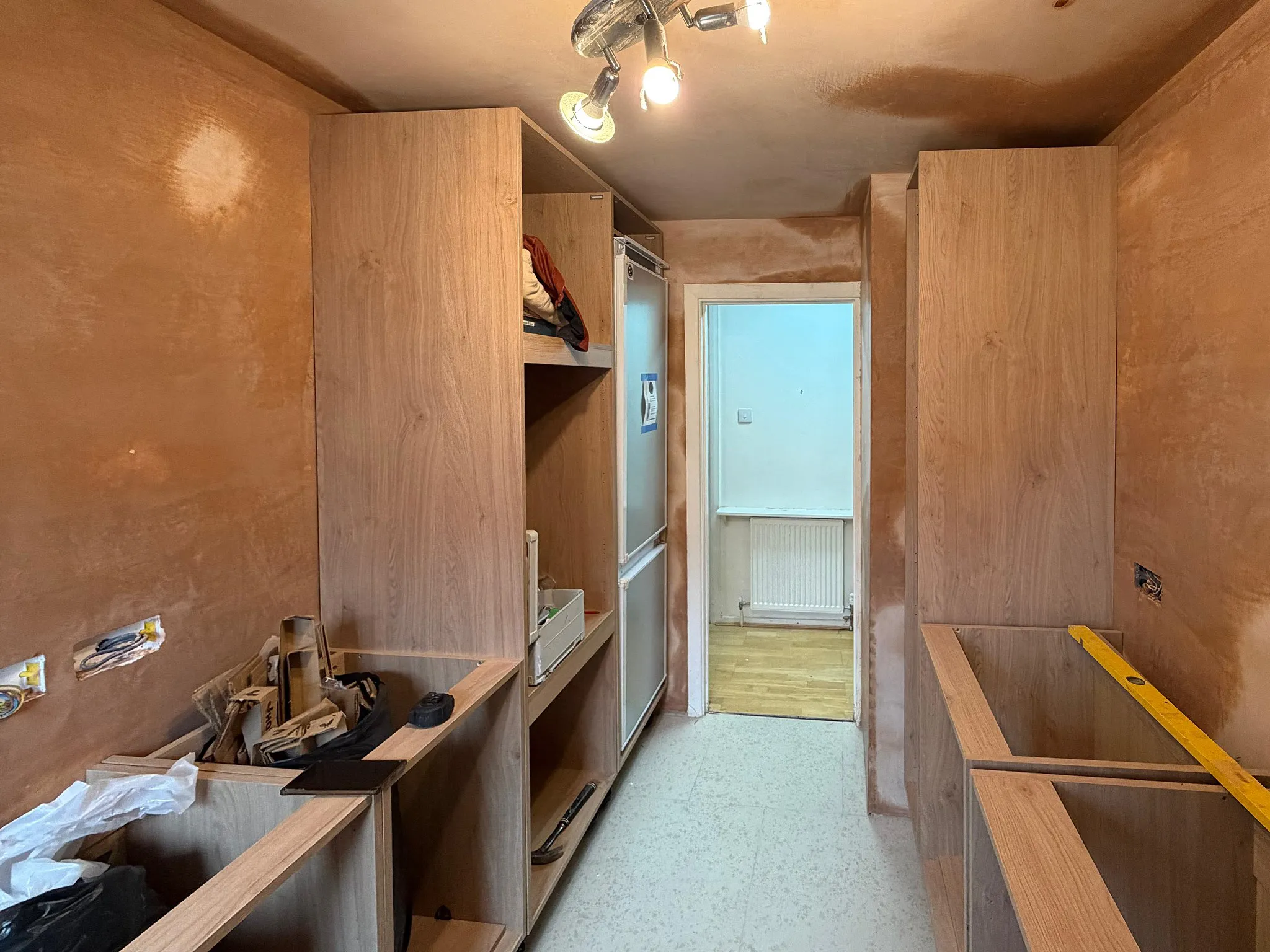 Kitchen cabinet carcasses being installed during bespoke kitchen fitting in Sutton Surrey