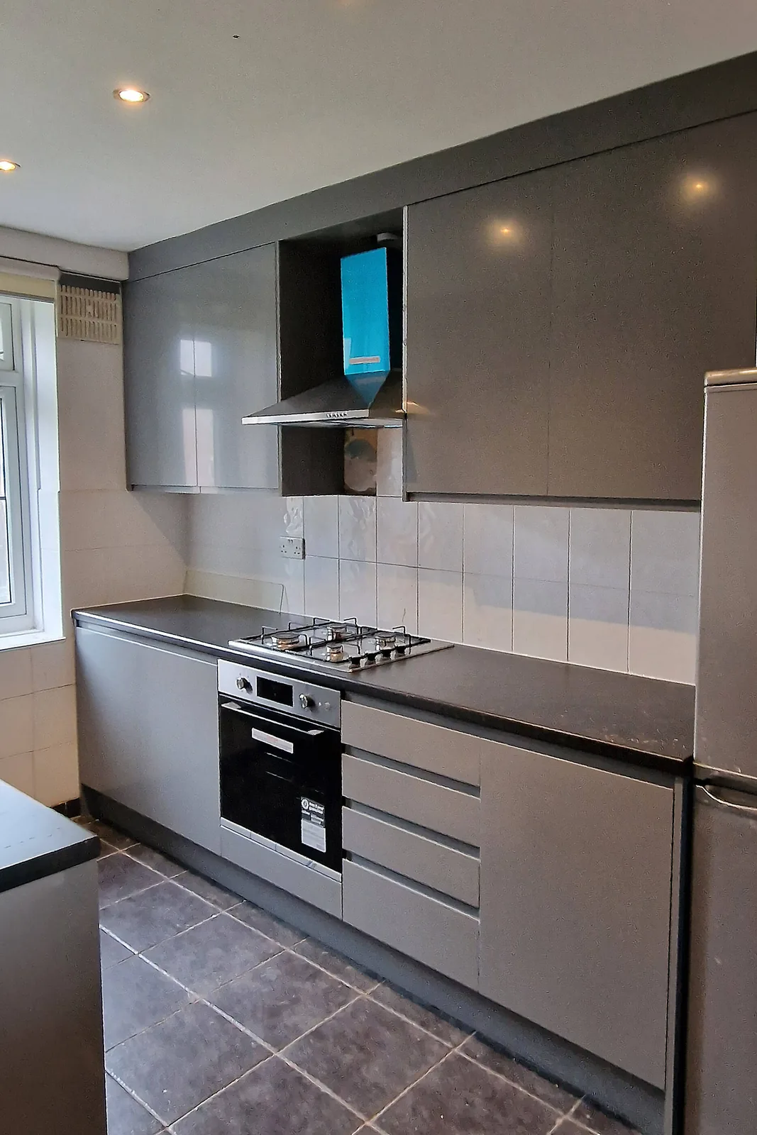 New fitted kitchen with gas hob, oven and fridge freezer in Carshalton SM5