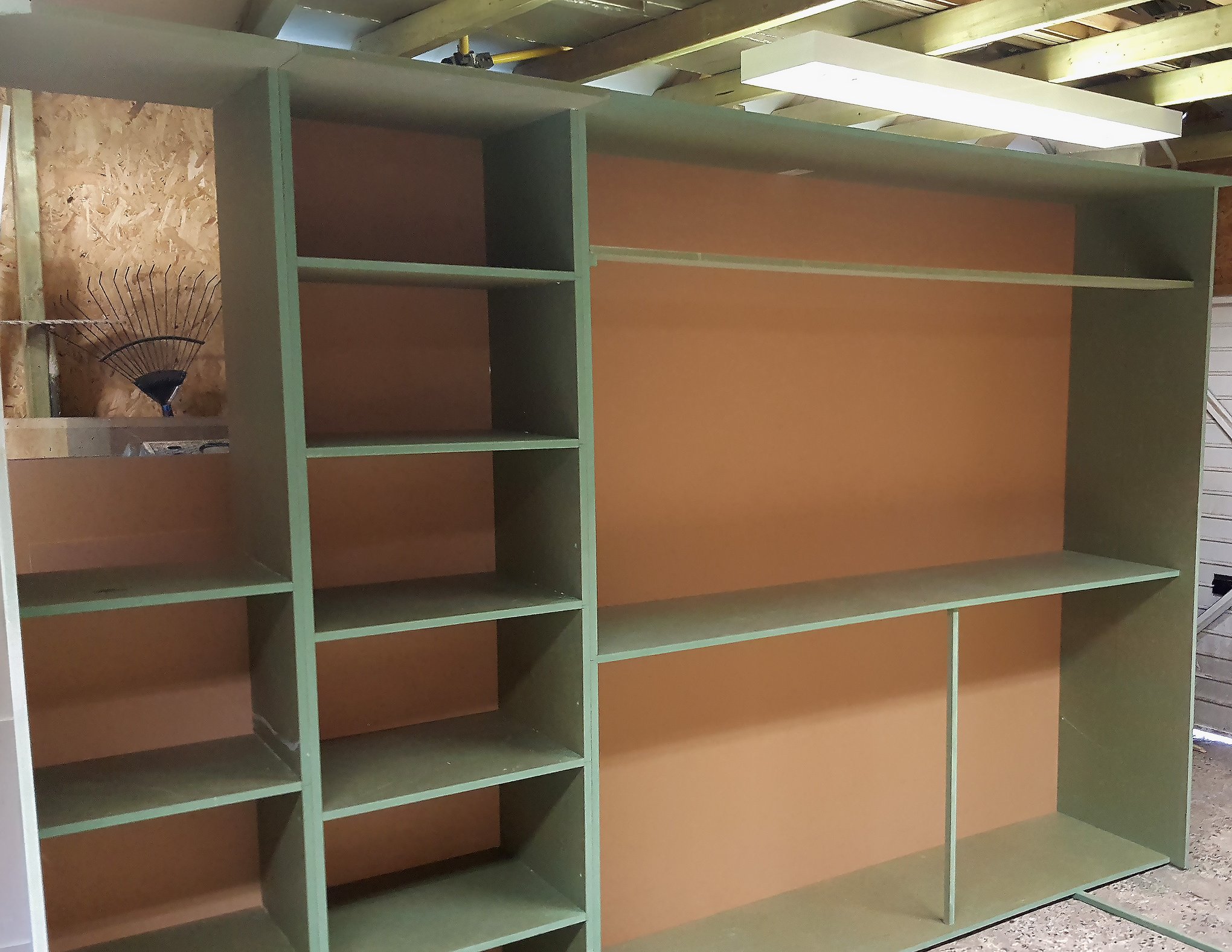 Wardrobe carcass built in the workshop Built-in wardrobe carcass with shelf columns and a wide hanging bay, assembled in the workshop