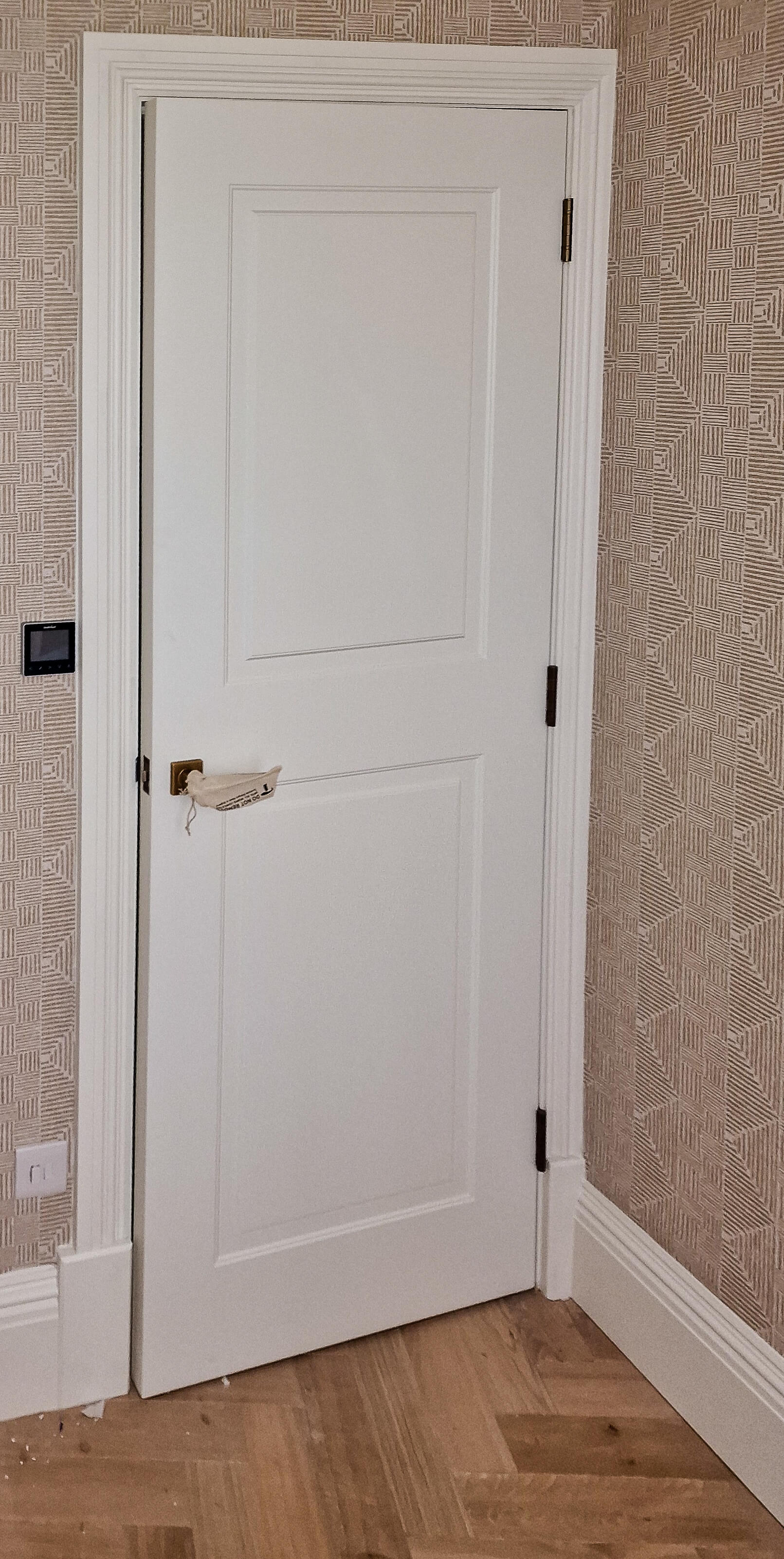 Panelled built-in door, part of the angled corner storage unit, Chelsea SW10 Bespoke panelled built-in cupboard door fitted into the angled hallway corner, Chelsea SW10