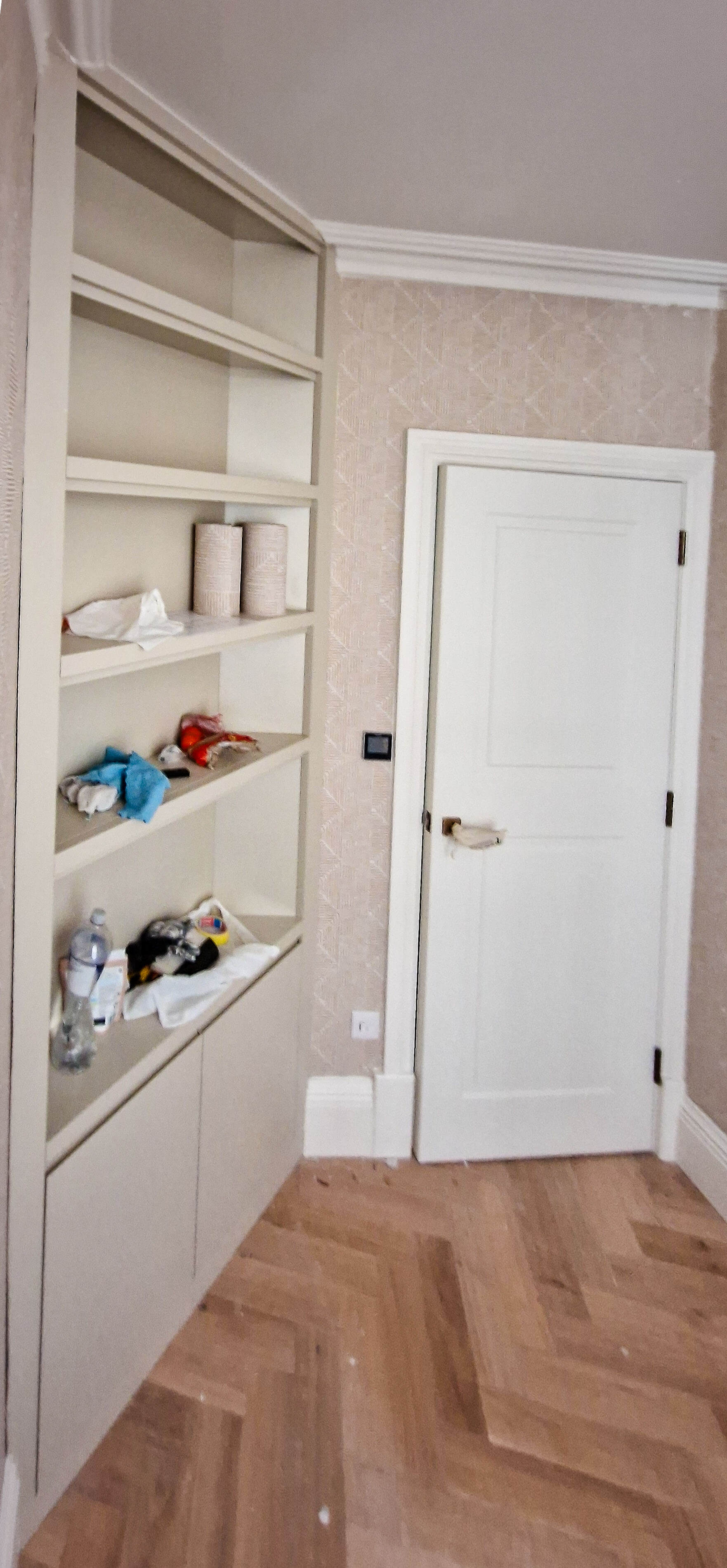 Hallway storage unit under construction, Chelsea SW10 Open shelf compartments of a custom hallway storage unit before finishing, built into an angled corner in Chelsea SW10